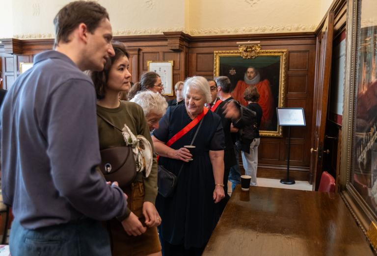 Master Brennan with visitors admiring the Inn's art work
